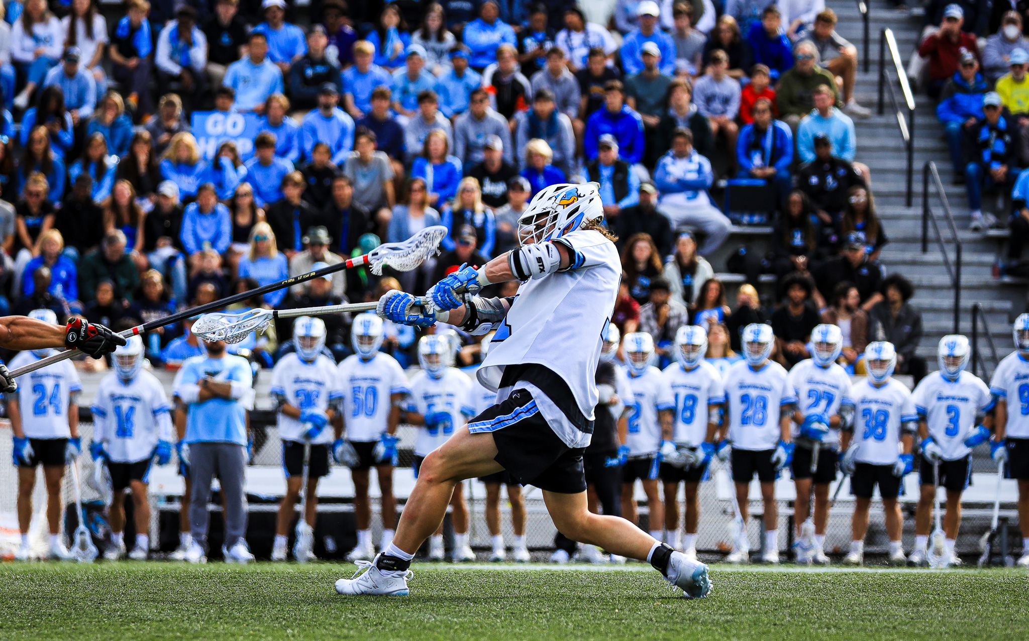 Johns Hopkins Lacrosse player shooting